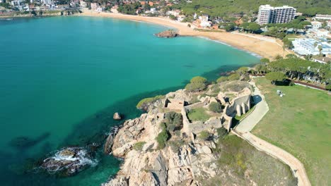 La-Fosca's-aerial-imagery-showcases-the-castle's-strategic-location-overlooking-the-Mediterranean-Sea,-offering-guests-unparalleled-views-and-a-sense-of-tranquility-amidst-the-bustling-coastline