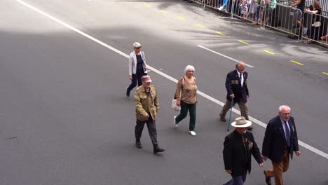 Representatives-from-the-1st-Australian-field-hospital-marching-down-the-street,-participating-the-annual-event,-the-Anzac-Day-parade-tradition-in-Brisbane,-Australia