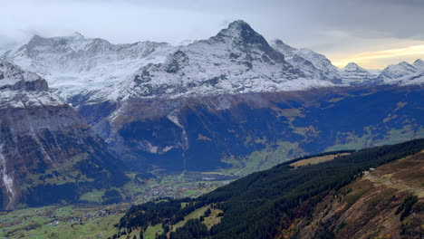 First-Cliff-metal-walk-way-Grindelwald-Switzerland-Swiss-Alps-snowy-Jungfrau-Junfrangu-glacier-Lauterbrunnen-mountain-peaks-October-cloudy-autumn-evening-landscape-sunset-static-shot