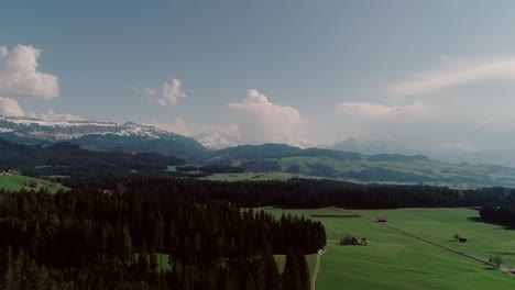 Aerial-of-Lakes,-Forests-and-Mountains-in-rural-Switzerland