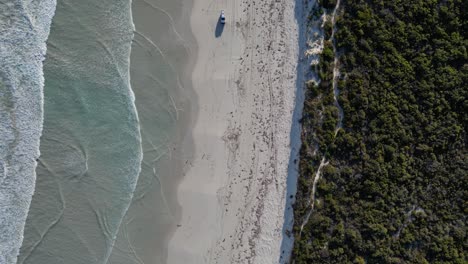 Safety-4x4-vehicle-on-sandy-beach-of-Australia-during-sunny-day