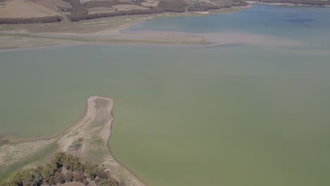 Aerial-orbit-over-the-drying-lake-of-Pozzillo,-Sicily,-Italy-showing-the-problems-with-drought