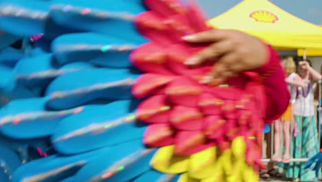 Woman-in-parrot-costume-spins-waving-feathered-wings-in-air