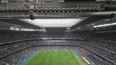 tilt-up-shot-of-Real-Madrid-stadium-during-football-soccer-corazon-classic-match-Real-Madrid-legends-vs-Oporto-vintage-in-march-2024-during-match-break