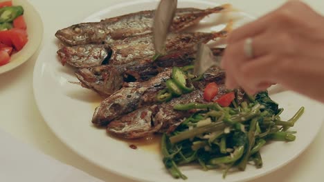 Pov-shot-of-enjoying-a-traditional-pinoy-local-daily-meal-of-fried-galonggong-and-kangkong-showing-the-authentic-Philippine-cuisine