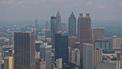 Atlanta-Georgia-Aerial-v970-zoomed-hyperlapse-drone-flyover-south-downtown-capturing-urban-cityscape-with-high-rise-buildings-and-clouds-covering-the-sky---Shot-with-Mavic-3-Pro-Cine---August-2023