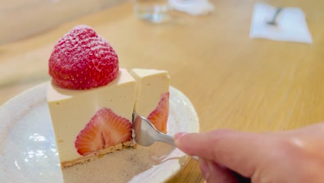 Cutting-Vegan-Raw-Strawberry-Cheesecake-Slice