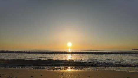 Sunrise-timelapse-from-the-seashore,-low-angle-view