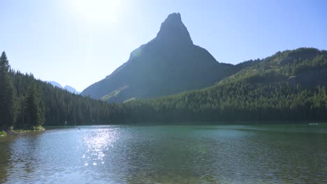 Grinnell-Point-in-Glacier-National-Park-viewed-across-lake,-pan