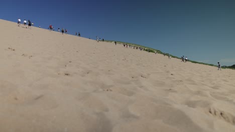 Sleeping-Bear-Sand-Dunes-National-Lakeshore-dune-climb-with-people-walking-on-the-dunes-and-gimbal-video-walking-forward-low
