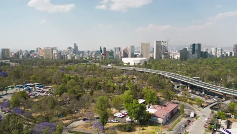Aerial-hyperlapse-Chapultepec,-Mexican-flag,-Polanco-and-traffic-Mexico-City