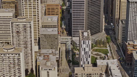 Calgary-AB-Canada-Aerial-v38-zoomed-birds-eye-view-drone-flyover-Downtown-Commercial-above-7-Ave-SW-capturing-skyscrapers-and-ctrain-metro-light-rail-system---Shot-with-Mavic-3-Pro-Cine---July-2023