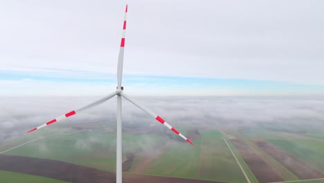 Orbiting-Wind-Turbine-Blade-Over-Hazy-Rural-Fields