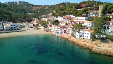 Sa-Riera,-situated-on-the-Costa-Brava,-seamlessly-blends-lavish-tourism-offerings-with-the-quaint-allure-of-fishing-huts