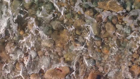Waves-Crashing-On-Pebbles-And-Rocks-On-The-Praia-Brana-de-Lazo-In-Camariñas,-A-Coruña,-Spain