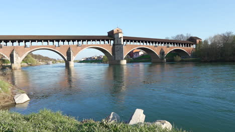 Nice-view-of-Ponte-Coperto-is-a-bridge-over-the-Ticino-river-in-Pavia-at-sunny-day,-Lombardy,-Pavia,-Italy