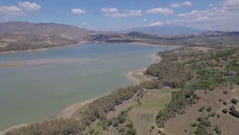 Aerial-shot-of-the-drying-lake-of-Pozzillo-near-Regalbuto-on-the-Erei-mountains-with-Etna-view-showing-the-problems-with-drought