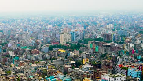 Rising-aerial-view-of-densely-populated-tropical-city-with-smog