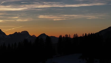 Silhouetted-mountains-against-a-fiery-sunset-sky-in-Amden,-Weesen,-Glarus,-Switzerland