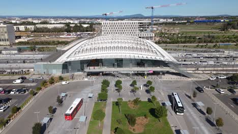 Montpellier-Sud-de-France-station,-viewed-from-above,-offers-a-striking-glimpse-of-modernity-against-backdrop-of-bustling-cityscape