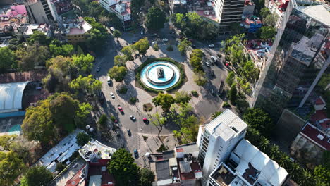 Mexico-City-Aerial-Drone-at-Magic-Hour,-Traffic-Circle,-Birds-Eye-Tracking