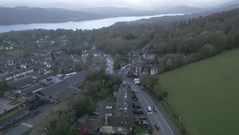 Drone-flying-over-Windermere-town-with-Lake-Windermere-in-distance