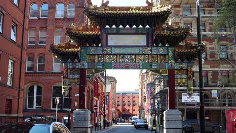 Ornamental-chinatown-gate-with-gold-and-red-arch-in-Manchester,-static