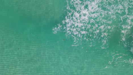 Drone-high-view-of-crystal-clear-waves