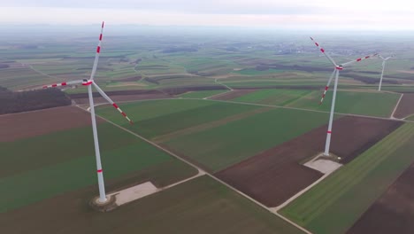 Onshore-Wind-Power-Plant-In-The-Field-With-Crops