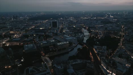 Night-Aerial-shot-of-Berlin-downtown-spree-river-in-Germany