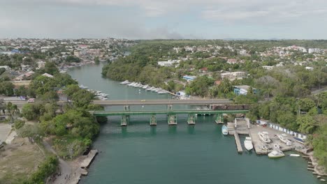 Charles-Bluhdorn-bridge-crossing-river,-La-Romana-port-in-Dominican-Republic