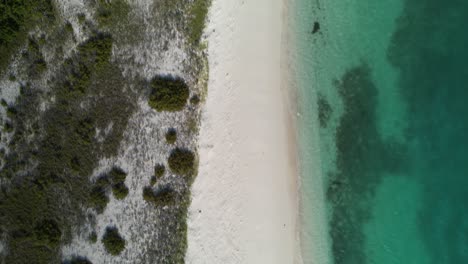 Aerial-top-down-view-of-Los-Roques-with-crystal-clear-waters-and-pristine-white-sands