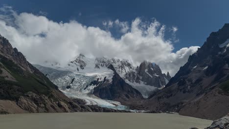 Fluffy-White-Clouds-Above-Cerro-Torre-Mountain-And-Laguna-Torre-In-Los-Glaciares-National-Park,-Argentina