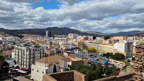 Timelapse-From-The-Castillo-de-Gibralfaro-Over-The-City-of-Malaga,-Fast-Moving-clouds,-Spain