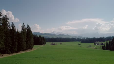 Aerial-of-Lakes,-Forests-and-Mountains-in-rural-Switzerland