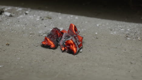 Embers-on-the-concrete-in-front-of-the-fireplace