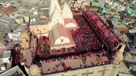 aerial-drone-view-you’re-going-from-front-to-back-where-many-people-are-playing-dhuleti-and-many-people-are-going-to-visit-the-temple