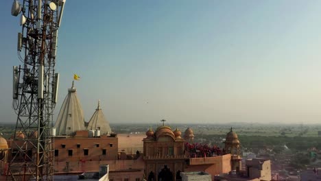 Aerial-drone-view-point-of-interest-shots-drone-camera-Many-people-are-on-top-of-the-temple-looking-at-people-and-many-people-are-playing-Dhuleti
