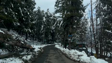 Snow-on-roads,-Snowboarding,-and-Majestic-View-in-Kashmir-India