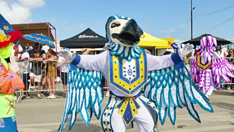 Dance-performer-in-blue-feathered-bird-costume-in-parade-for-Carnaval
