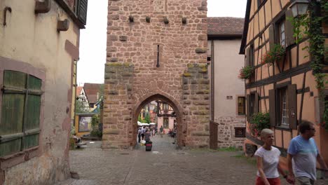 Fortified-gateway-to-the-town-has-a-25-meter-high-belfry-offering-a-bellicose-face-to-the-outside-and-a-benevolent-aspect-inside-the-Riquewihr-village