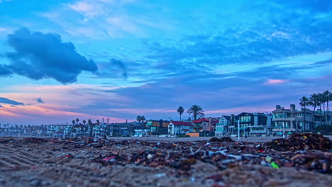 Time-Lapse,-Colorful-Sky-and-Clouds-Moving-Above-Manhattan-Beach-Waterfront-Properties,-Evening-to-Sunset