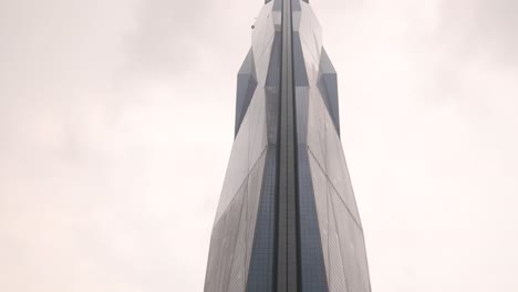 looking-up-at-view-of-ultra-modern-Merdeka-118-Tower,-the-second-tallest-building-in-the-world-in-Kuala-Lumpur,-Malaysia-skyline
