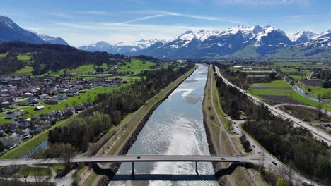 Cars-on-bridge-crossing-rhine-river-between-Switzerland-and-Liechtenstein