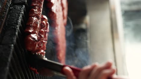 Grilling-a-Juicy-Beef-Hot-Dog-Sausage,-Cinematic-Vertical-Close-up
