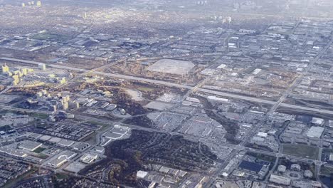 Aerial-view-of-Toronto-suburbs-as-seen-from-airplane-approaching-airport,-Ontario-in-Canada