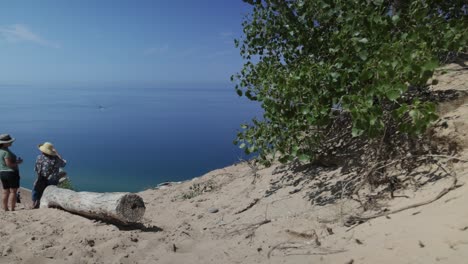 Sleeping-Bear-Sand-Dunes-National-Lakeshore-overlook-of-Lake-Michigan-in-Michigan-with-people-and-gimbal-video-moving-forward-low
