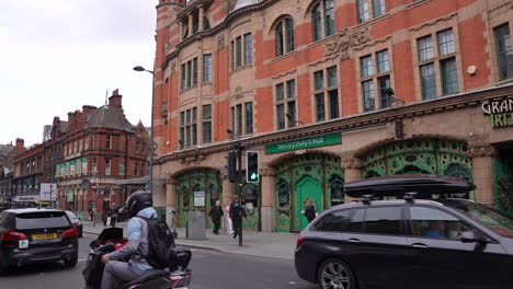 Liverpool,-England-UK,-Vintage-Buildings,-Street-Traffic-on-Renshaw-Street-and-Rude-Motorcyclist-Showing-Middle-Finger-to-Camera,-Slow-Motion