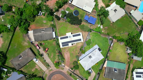 Aerial-Drone-of-Average-Suburban-Home-With-Dirt-Driveway-Entrance,-Top-Down-Descend