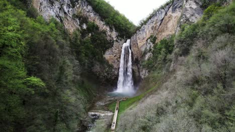 An-areal-shoot-of-a-beautiful-waterfall-in-Bosnia-and-Herzegovina,-with-a-slightly-tilt-in-the-camera